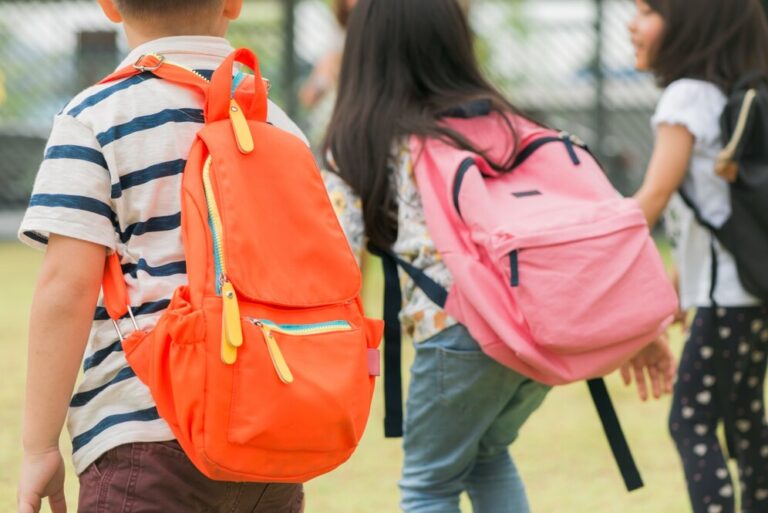 three-pupils-primary-school-go-hand-hand-boy-girl-with-school-bags-back-beginning-school-lessons-warm-day-fall-back-school-little-first-graders_1253-1134