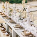 long-dinner-table-decorated-with-flaxen-cloth-white-candles_1304-3245