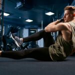 muscular-man-doing-crunches-floor_651396-1595