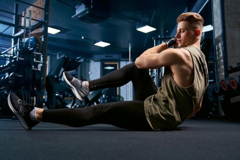 muscular-man-doing-crunches-floor_651396-1595