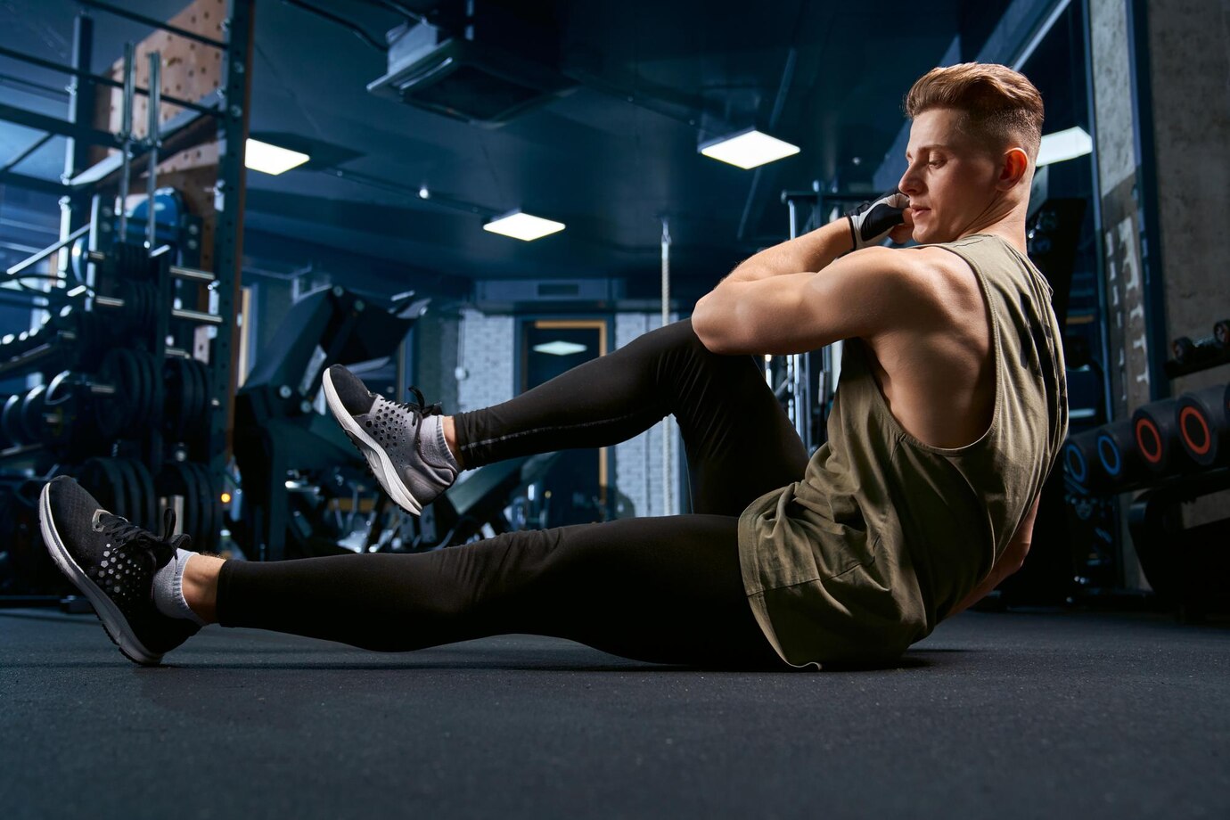 muscular-man-doing-crunches-floor_651396-1595