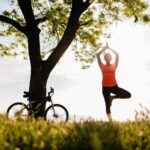 slim-beautiful-woman-silhouette-doing-sports-morning-park-doing-yoga_285396-4331