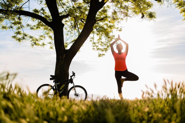 slim-beautiful-woman-silhouette-doing-sports-morning-park-doing-yoga_285396-4331