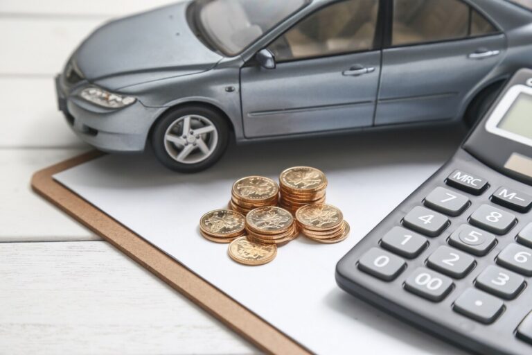 car-model-calculator-coins-white-table_1387-584