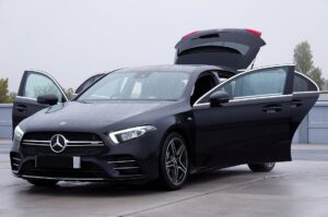 free-photo-of-sleek-black-mercedes-hatchback-with-open-doors